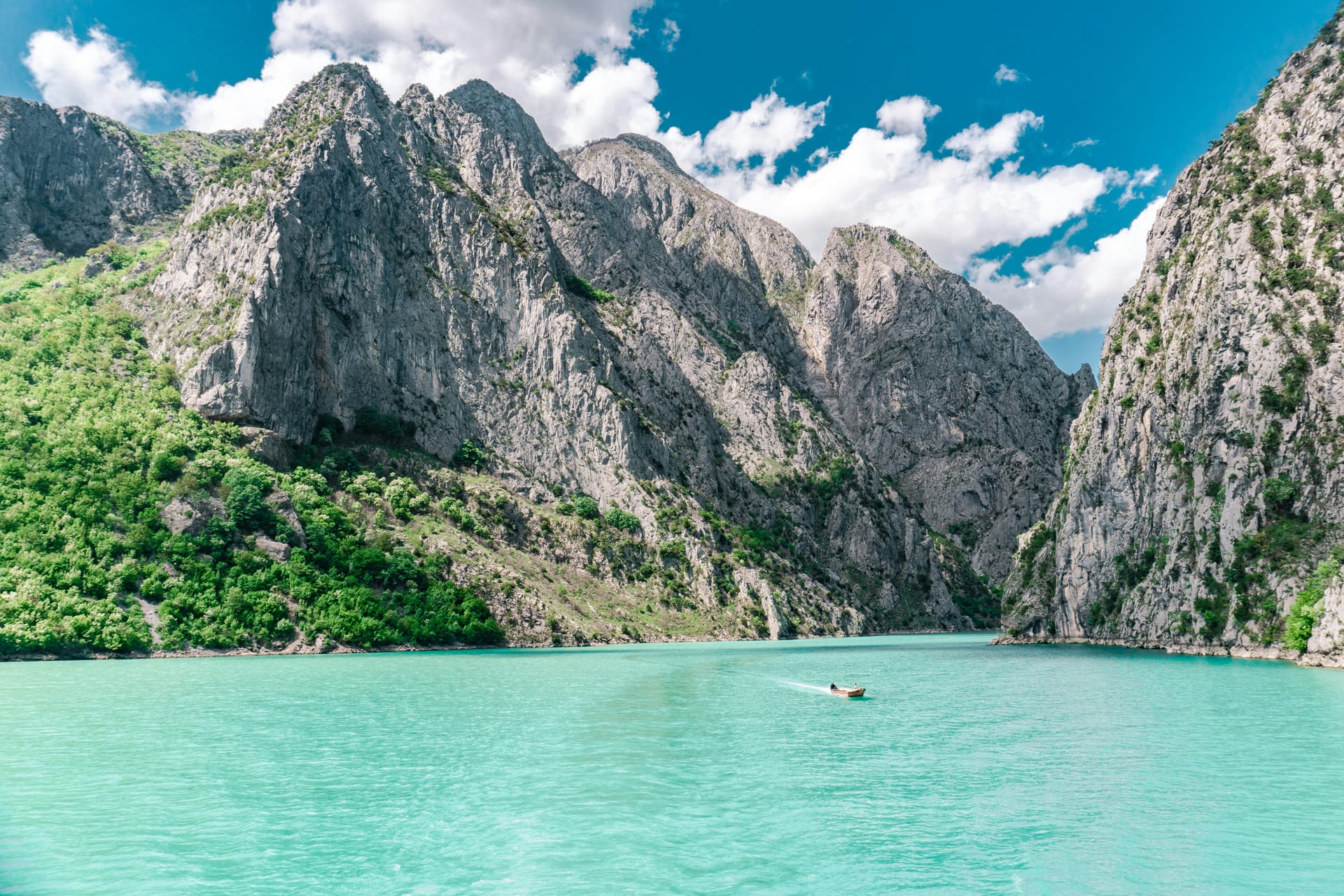 A view of the turquoise Shala River flowing through a steep, rocky canyon in the Albanian Alps.